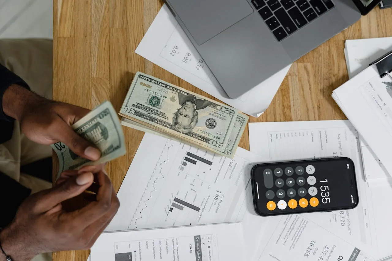 SME business owner reviewing an IT service provider quote at their desk — managed IT pricing 2026