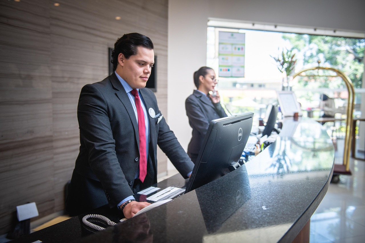 Hotel reception with computer workstation — hospitality IT managed services